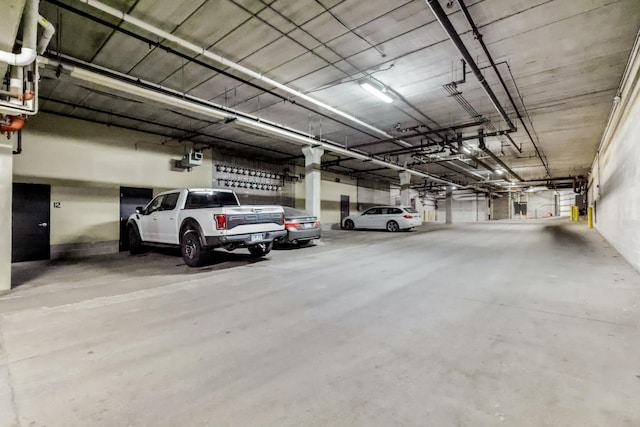 parking garage featuring a garage door opener