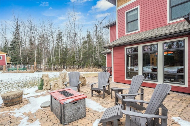 view of patio / terrace featuring an outdoor fire pit