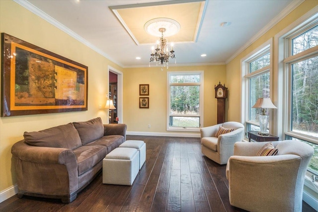 living room with ornamental molding, a wealth of natural light, dark wood finished floors, and baseboards