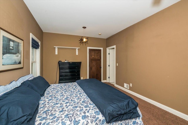 carpeted bedroom featuring visible vents and baseboards