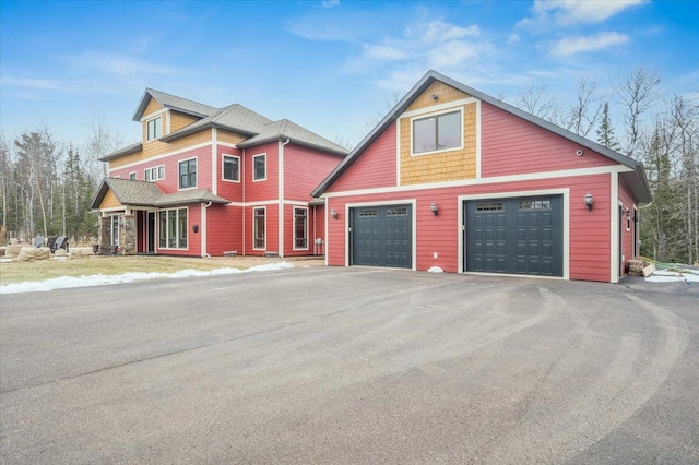 view of front of home with a garage and driveway