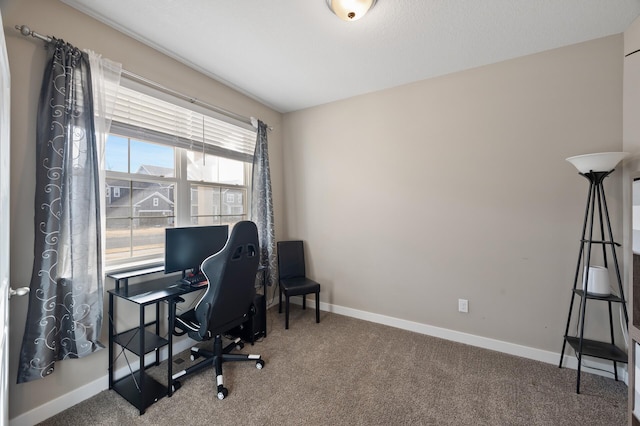 carpeted office with baseboards