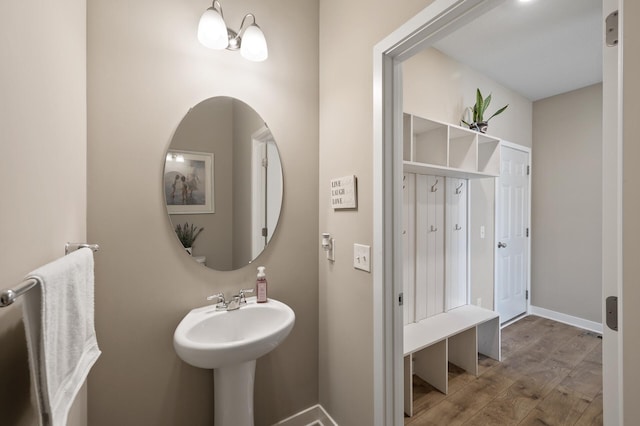 bathroom featuring baseboards and wood finished floors