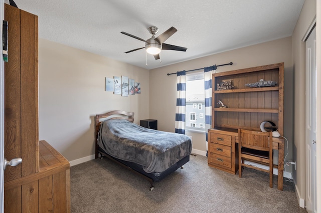 bedroom with a ceiling fan, carpet, baseboards, and a textured ceiling