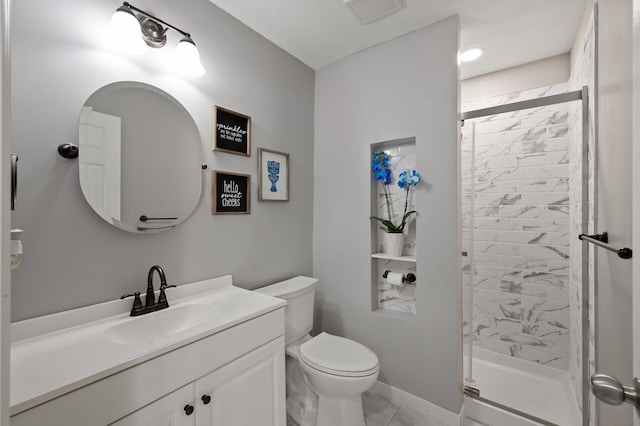 full bath featuring visible vents, a shower stall, baseboards, toilet, and vanity