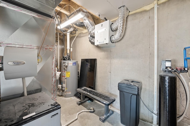 utility room featuring water heater