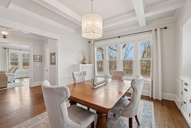 dining area with beam ceiling, ornamental molding, dark wood finished floors, baseboards, and a chandelier