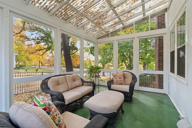 sunroom featuring plenty of natural light and lofted ceiling