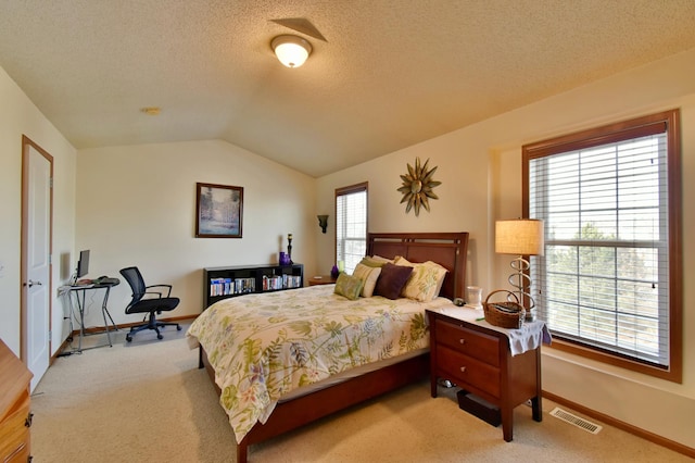 bedroom featuring visible vents, baseboards, carpet, and lofted ceiling