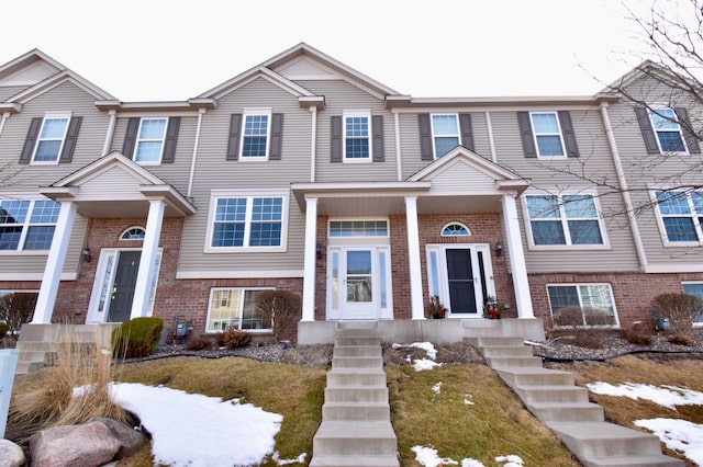 view of front of house featuring brick siding