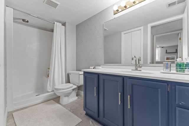 full bathroom with visible vents, a shower stall, toilet, and vanity