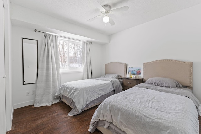 bedroom with baseboards, wood finished floors, and a ceiling fan