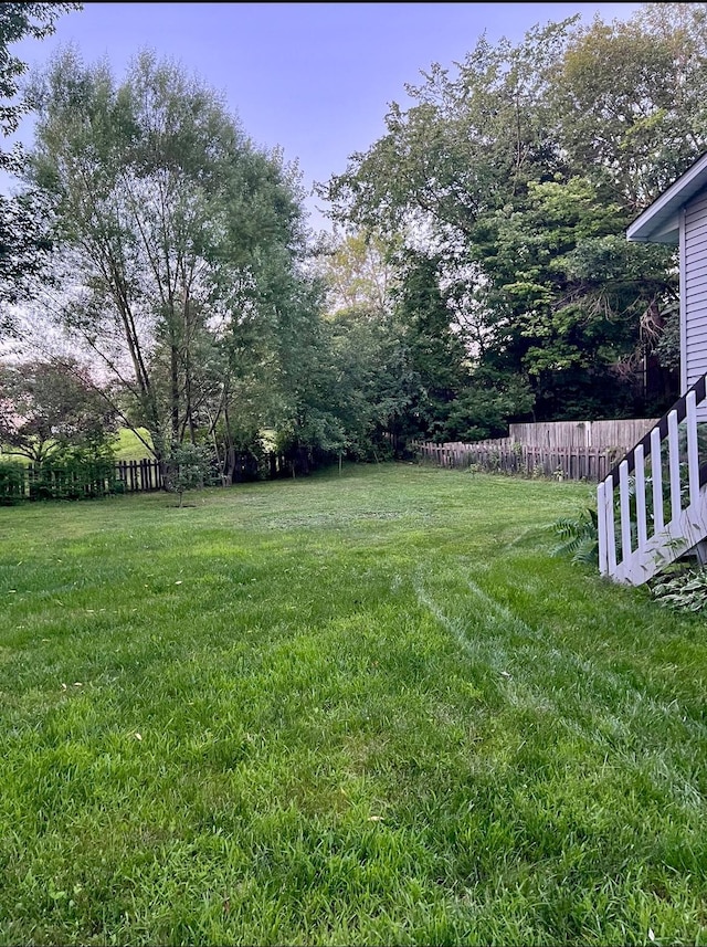 view of yard with fence