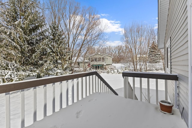 view of snow covered deck