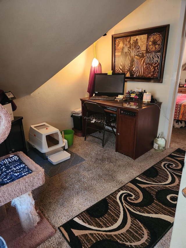 carpeted office with lofted ceiling