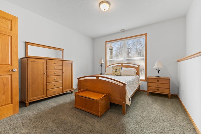 carpeted bedroom with baseboards