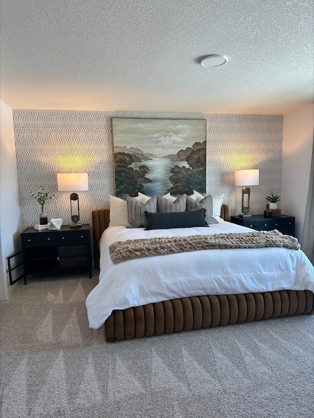 bedroom with carpet and a textured ceiling