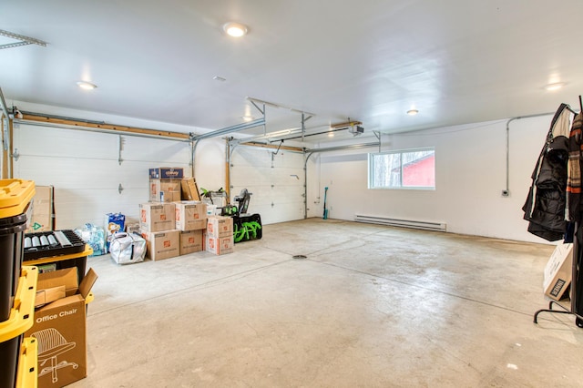 garage with a baseboard heating unit and a garage door opener