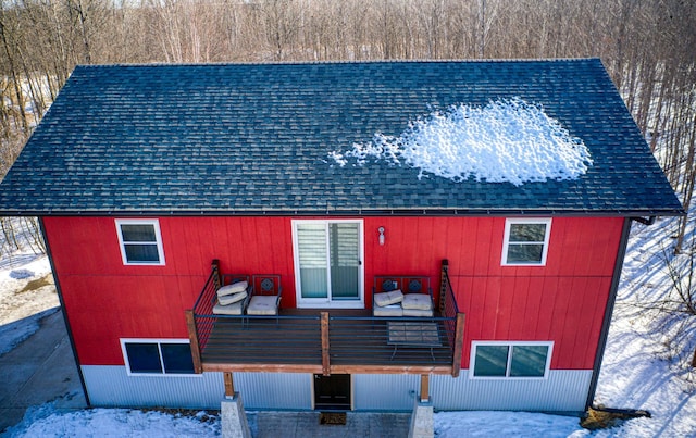 exterior space with a shingled roof