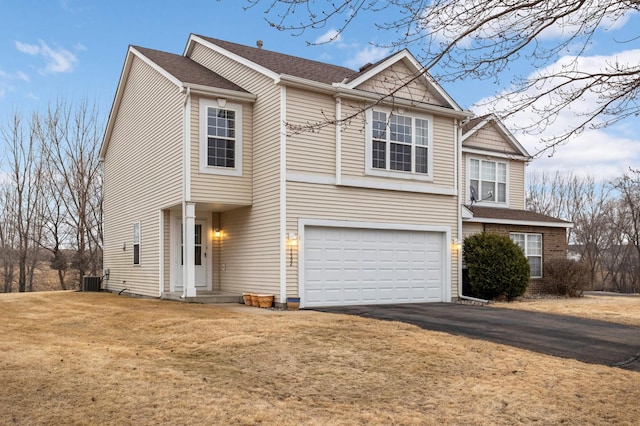 view of front of property featuring central air condition unit, a garage, driveway, roof with shingles, and a front lawn