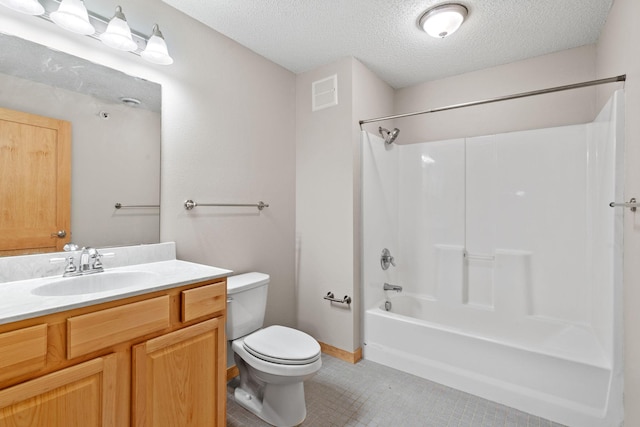 full bath featuring vanity, visible vents, bathtub / shower combination, a textured ceiling, and toilet