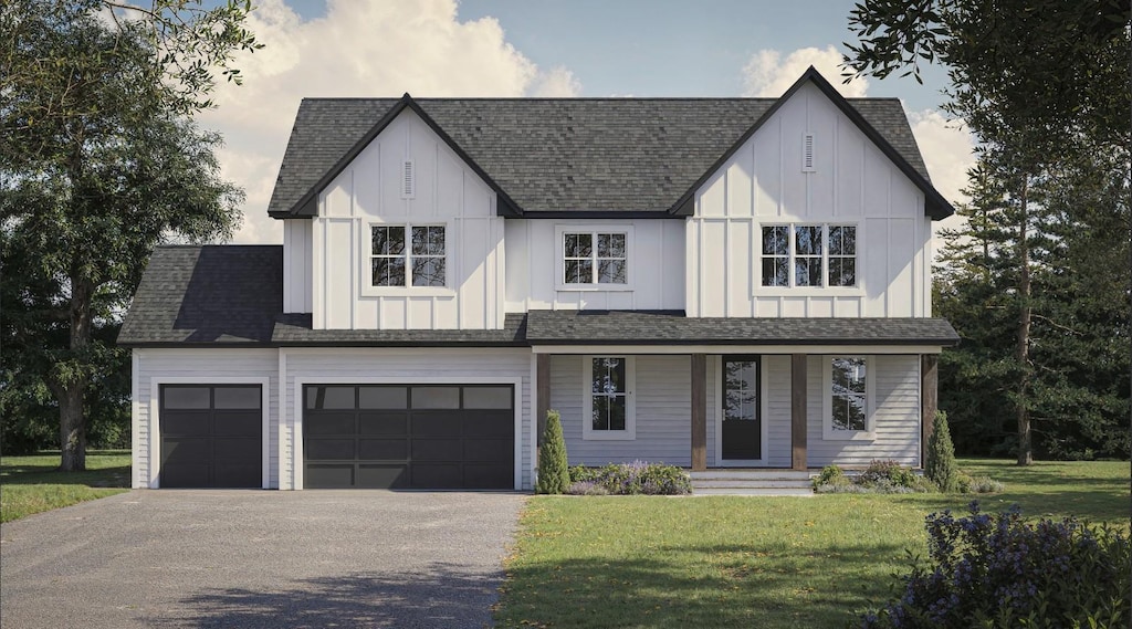 view of front of home featuring driveway, a front lawn, board and batten siding, and roof with shingles