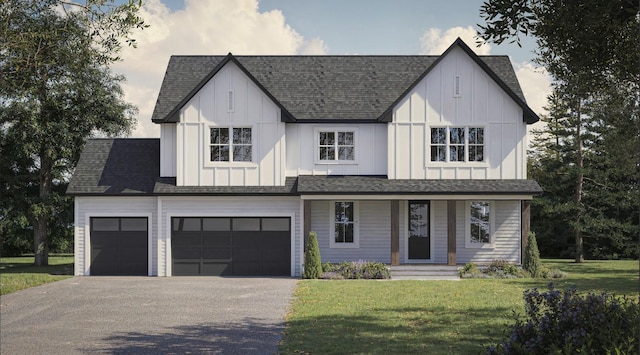 view of front of home featuring driveway, a front lawn, board and batten siding, and roof with shingles