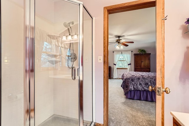 ensuite bathroom featuring a stall shower, connected bathroom, and ceiling fan