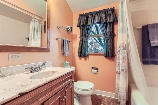 bathroom featuring toilet, shower / tub combo, baseboards, and vanity