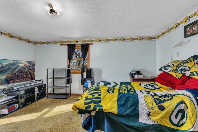 carpeted bedroom featuring a textured ceiling