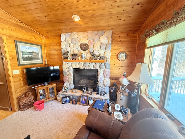 carpeted living room with wood ceiling, vaulted ceiling, and wood walls