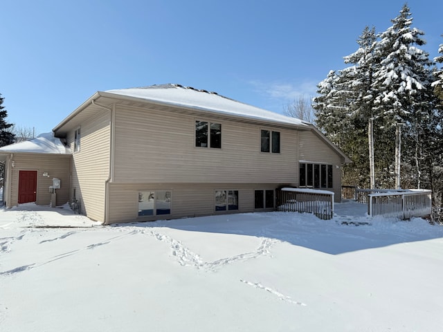 view of snow covered house