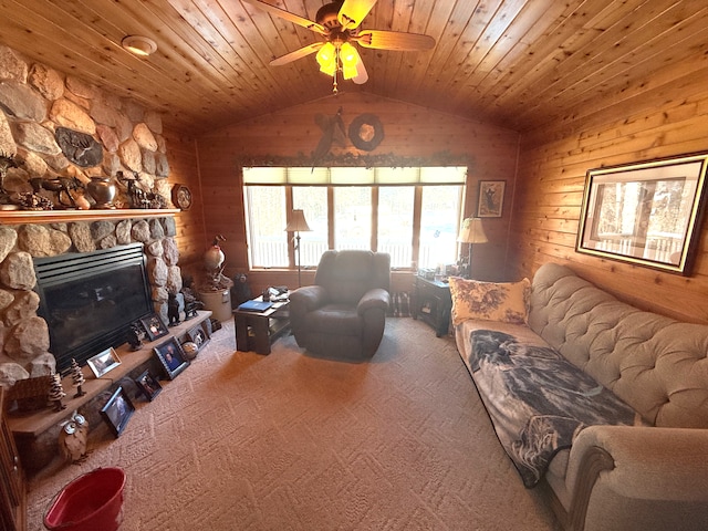 living area featuring a fireplace, lofted ceiling, wood ceiling, carpet flooring, and wood walls