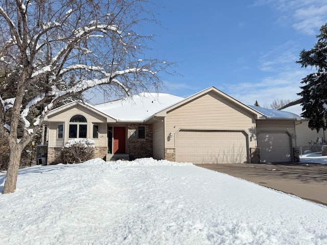 single story home with a garage and driveway