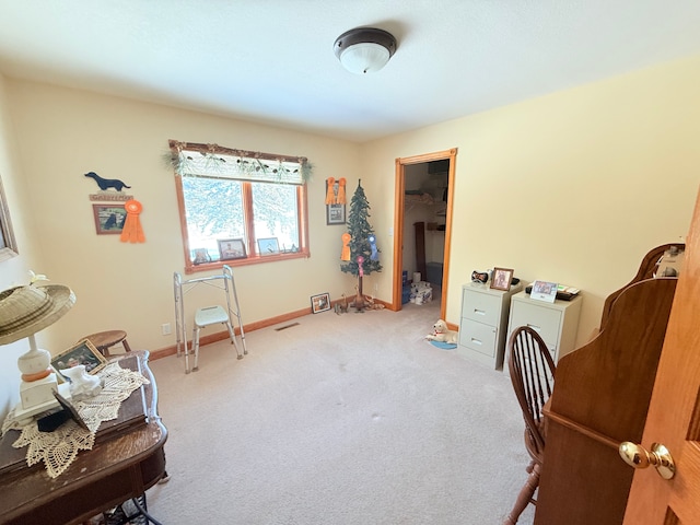 living area with carpet, visible vents, and baseboards