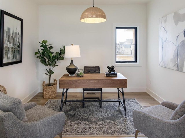 office space featuring wood finished floors and baseboards