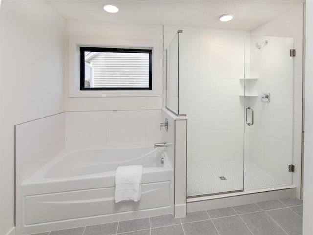 full bath featuring tile patterned flooring, a shower stall, recessed lighting, and a bath