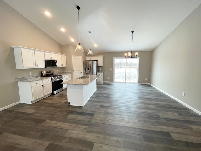 kitchen with baseboards, dark wood finished floors, appliances with stainless steel finishes, white cabinetry, and a sink