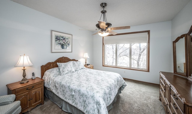 carpeted bedroom featuring ceiling fan and baseboards