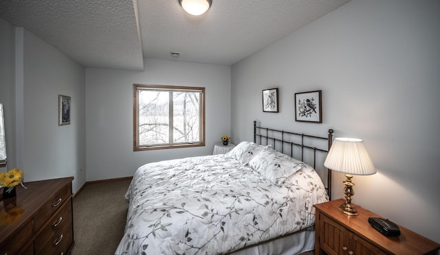 carpeted bedroom featuring a textured ceiling and baseboards