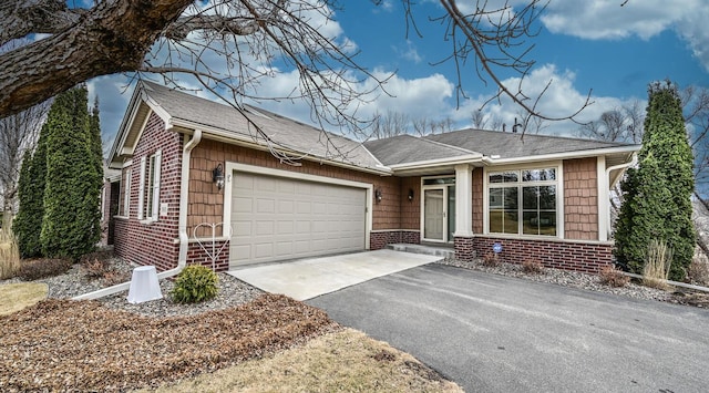 ranch-style house featuring a garage, brick siding, and driveway