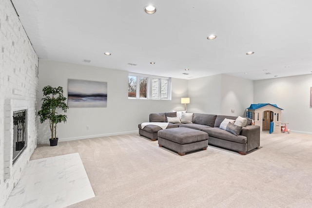 living room with baseboards, recessed lighting, a fireplace, and light colored carpet