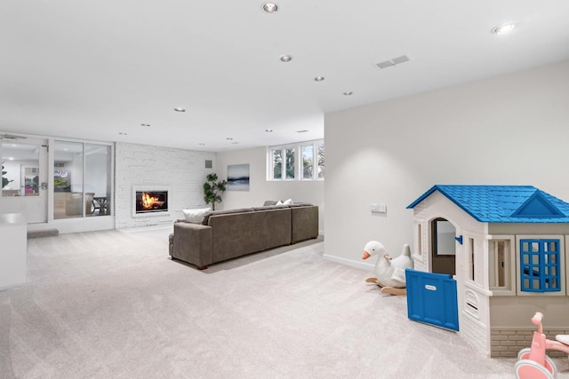 living room with recessed lighting, carpet floors, a fireplace, visible vents, and baseboards