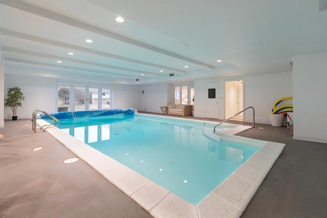 indoor pool featuring french doors