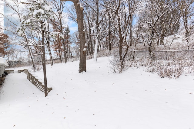 view of yard layered in snow