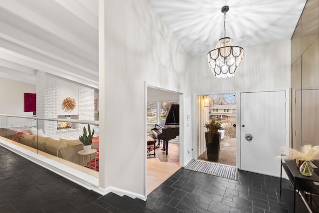 1345 Fairlawn Way, Golden Valley, MN 55416 - foyer entrance featuring a chandelier, stone tile floors, and a towering ceiling