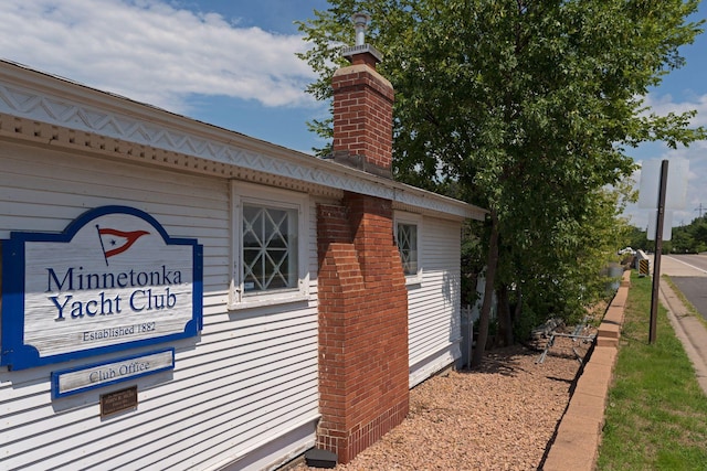 view of side of home featuring a chimney