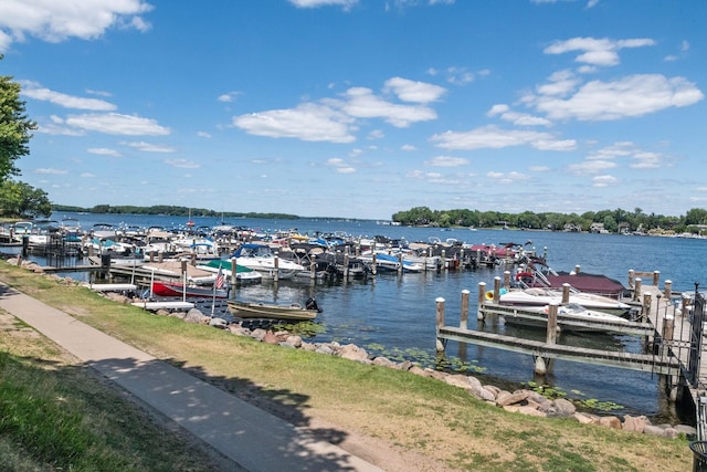 dock area with a water view and boat lift