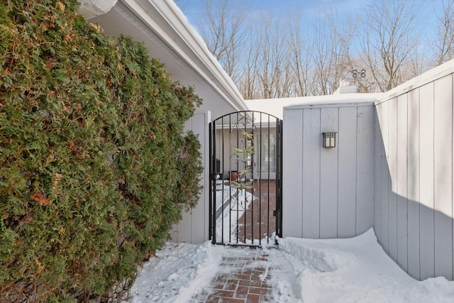 view of snow covered gate