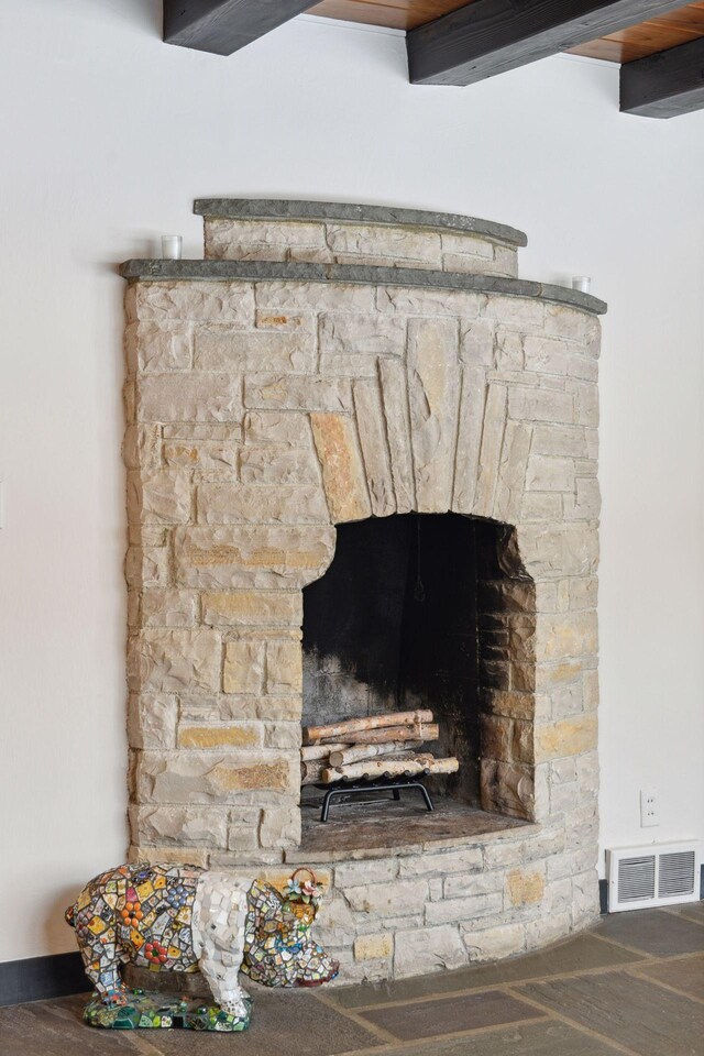 room details featuring a fireplace and visible vents